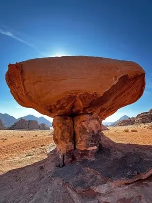 a rock formation in the middle of the desert at Wadi rum Mahmoud tours in Wadi Rum