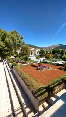 a park with a garden with flowers and trees at منتجع وفيلا تل الرمان in Ar Rummān