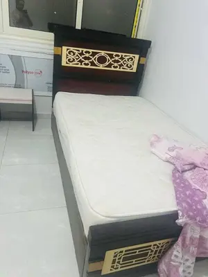 a bedroom with a bed in a room at عبق التاريخ هاوس in Rujm al Ḩāwī