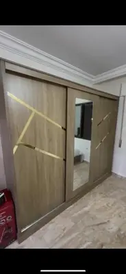 a garage door with a mirror in a room at Beautiful Apartment in irbid in Aydūn