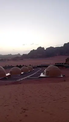 a row of domes in the middle of a desert at Suleman Bedouin Life Camp in Wadi Rum