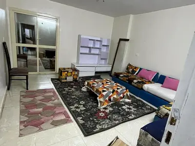 a living room with a couch and a rug at جبال الاردن in Amman