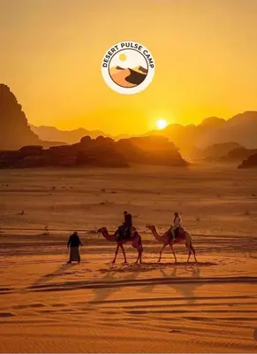 two people riding camels in the desert at sunset at RUM BULSE BUBBLE lUXURY CAMP in Disah