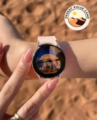 a person holding a watch on a persons wrist at RUM BULSE BUBBLE lUXURY CAMP in Disah