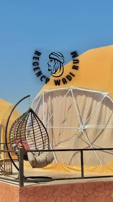a bird cage on the side of a building at Regency Bubble Wadi Rum in Wadi Rum