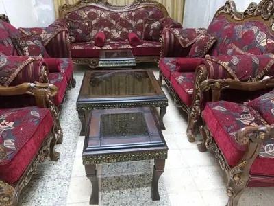 a group of couches and tables in a room at رزق هاوس in Ash Shūnah ash Shamālīyah