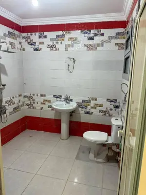 a bathroom with a toilet and a sink at رزق هاوس in Ash Shūnah ash Shamālīyah