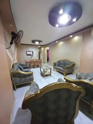 a living room with couches and a table at رزق هاوس in Ash Shūnah ash Shamālīyah