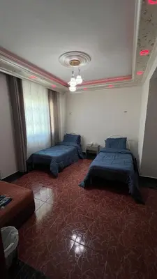 a room with two beds in a room at Royal in Aqaba