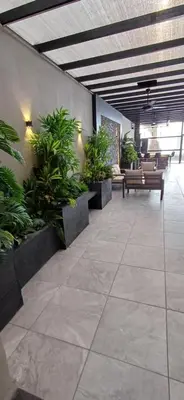 a lobby with benches and plants in a building at LAVA Resort Hot spring water in Mukāwir