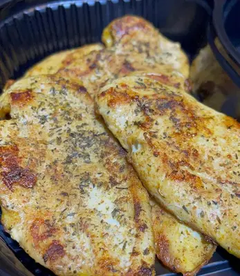 four pieces of food in a pan at غباوي موتل in Az Zarqa