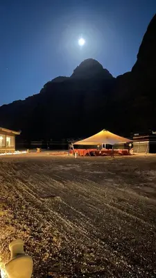 a tent in a field with a mountain in the background at مخيم خيال رم in Jurf ad Darāwīsh