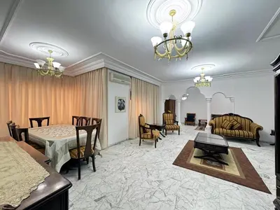 a living room with a bed and a dining room at شقة مفروشة للايجار مميزه هادئه امنه ذات اطلاله رائعه in Amman