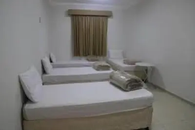 a room with two beds in a room at المناره ان in Amman