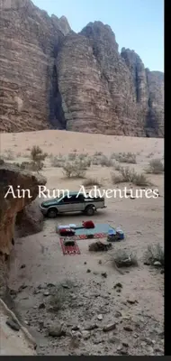 a truck parked in the middle of a desert at مغامرات عين رم in Jurf ad Darāwīsh
