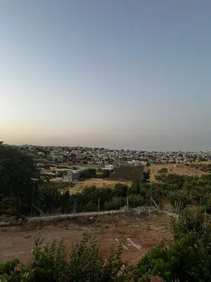 a view of a city from the top of a hill at الاردن in Jurf ad Darāwīsh