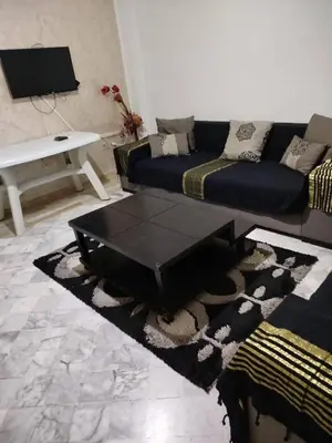 a living room with a couch and a coffee table at bong chalet in Amman