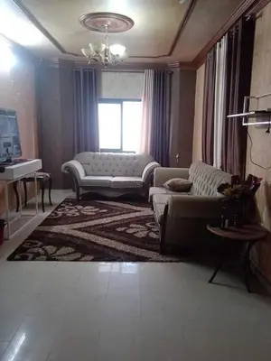 a living room with a couch and a window at bong chalet in Amman