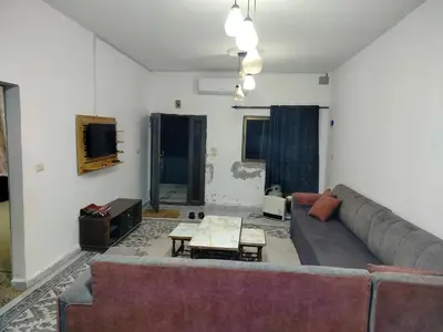 a living room with a couch and a table at شقق ابو يزن عجلون بالقرب من محمية عجلون in Ajloun