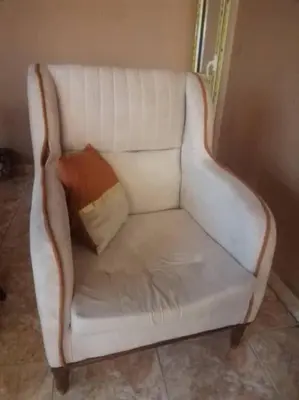 a white couch with a pillow on top of it at البويضه هاوس in Al Buwayḑah