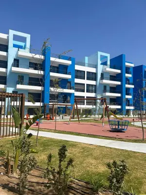 a playground in front of a large apartment building at Ayla Beach Apartment Azure 1522 Families only in Aqaba