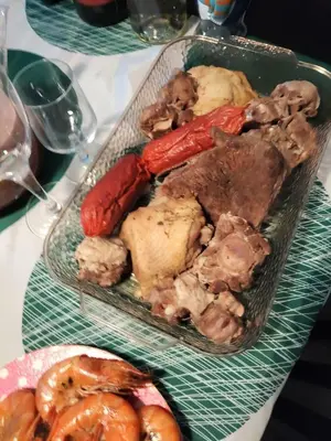 a tray of food with meat and vegetables on a table at الثغره هاوس in Abū al Lasan