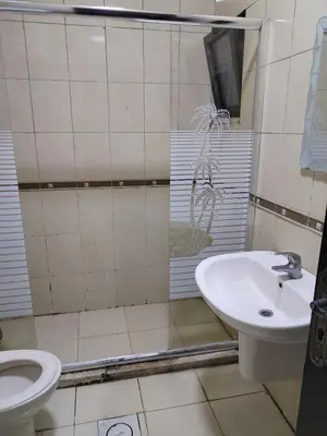 a bathroom with a sink and a toilet at عمان in Jurf ad Darāwīsh
