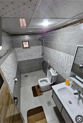 a small bathroom with a toilet and a sink at Star Wars luxury camp in Wadi Rum
