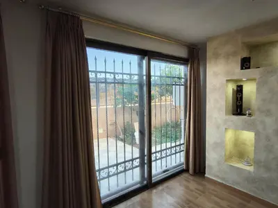 a room with a large glass door with a balcony at Shafa Badran Studio in Jurf ad Darāwīsh