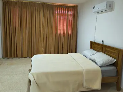 a bedroom with a bed and a window at Shafa Badran Studio in Jurf ad Darāwīsh
