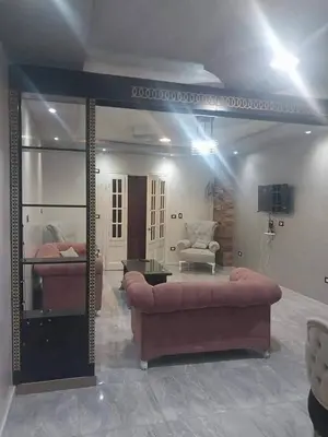 a large living room with a couch and a chair at ابيت السعاده in Ar Ramthā