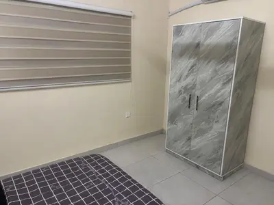 a walkin closet with a metal door in a room at Bubbles in Jurf ad Darāwīsh