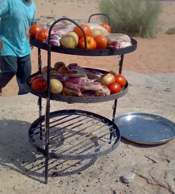 a display of fruits and vegetables on a stand at مخيم الخال in Yarqā