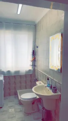 a bathroom with a toilet and a sink at شقق ڤيڤا - viva Apartments in Amman