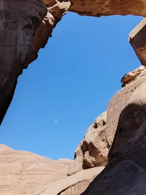 a view of the sky through a rock formation at Wasan Camp Wadi Rum in Wadi Rum