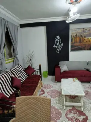 a living room with a couch and a table at ايدون هاوس in Aydūn