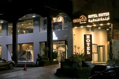 a store front of a building at night at Easy Inn Hotel Suites in Amman