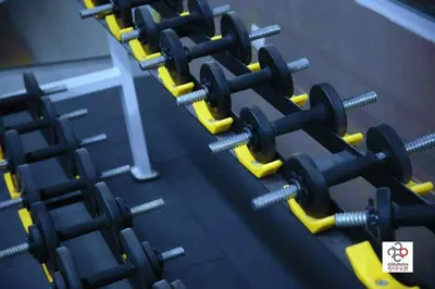 a row of dumbbells in a gym at Der Ghbar Luxe in Amman