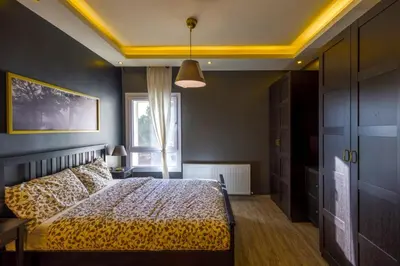 a bedroom with a bed and a window at Der Ghbar Luxe in Amman