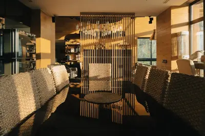 a row of chairs with a table in a restaurant at Al Bader Resort in Jurf ad Darāwīsh