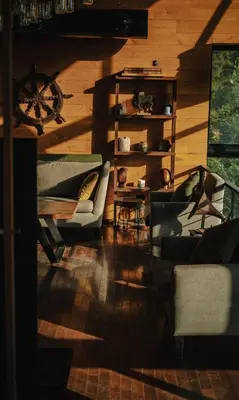 a living room with two couches and a table at Al Bader Resort in Jurf ad Darāwīsh