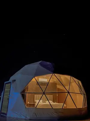 an igloo with a box inside of it at Wadi Rum Sha ar Nights in Wadi Rum