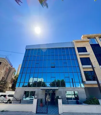 a large glass building with the front of it at Al safa in Amman