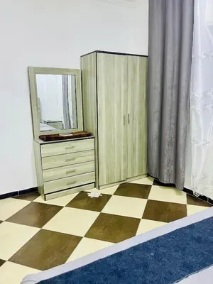 a dressing room with a dresser and a mirror at Al safa in Amman