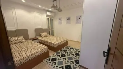 a room with two beds in a room at صبحه هاوس in Şabḩā