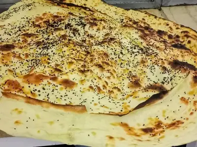 a close up of a tortilla with seasoning on it at شلنر موتل in Khirbat ar Ruşayfah