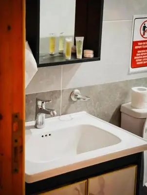 a bathroom with a white sink and a toilet at RUM DREAM CITY lUXURY CAMP in Wadi Rum