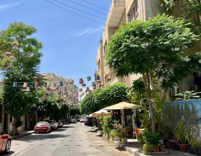 a city street with trees and plants on the side at Modern Studio Apartment Near Downtown, breathtaking view! in Amman