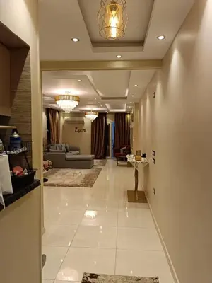 a hallway of a living room with a couch at بليله هاوس in Balīlā