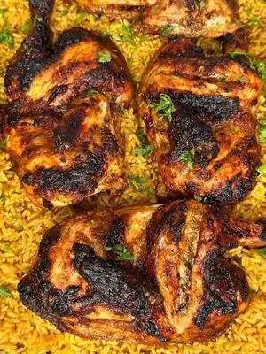 a pile of food sitting on top of rice at شقه الحنان in Dayr as Si‘nah